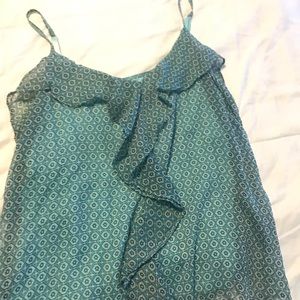 Blue geometric tank with ruffle and overlay